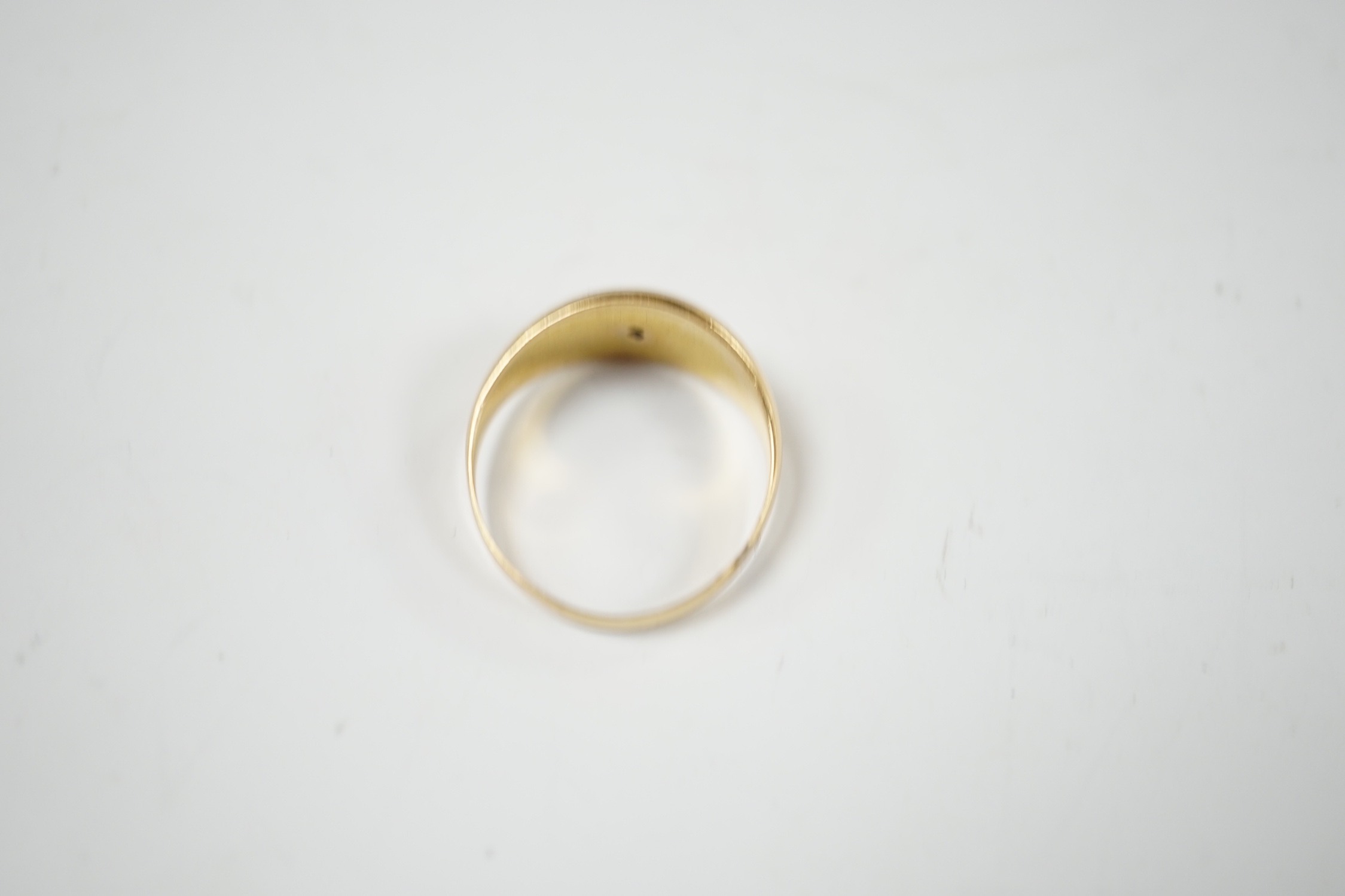 A George V 18ct gold and three stone gypsy set diamond chip set ring, size R, gross weight 3.3 grams.